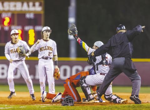 St. Cloud’s defense played the rundown perfectly Friday, as catcher Samuel Quijada tags Harmony’s Angel Medina at first base while Nathan Bianco (1) and Jayden Luciano (27) back up the play. (Photo/Taylor McFee)
