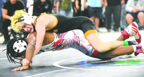Nathan Lyttle will battle to do what only Sawyer Root has done: win multiple state wrestling championships for Harmony High. (File Photo)