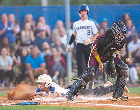 After delivering a two-run double in the fourth, Harmony’s Ashton Fayne tacks on another Longhorn run beating a throw to the plate in the home team’s 8-2 District 7A-9 win Friday. (Photo/Taylor McFee)