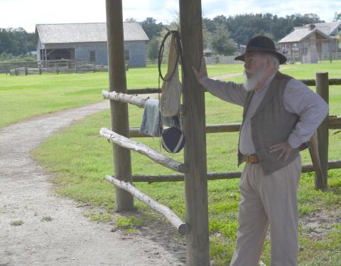 Retired history teacher John Holmes shares the history of the Florida cow hunters at Pioneer Village.