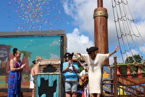 Give Kids the World CEO Pam Landwirth "christens" the Serendipity joined by the mothers of some of the namesakes on the ship. PHOTO/KEN JACKSON
