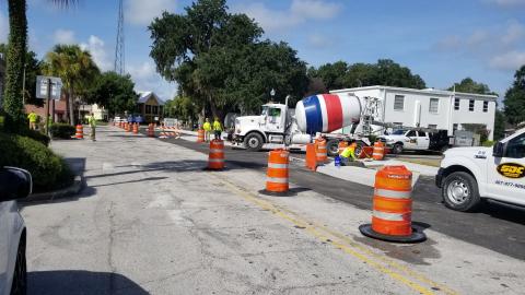 A work crew pours concrete Monday morning on Church Street and Monument Avenue. The street project is set to be completed in a couple weeks. PHOTO/KEN JACKSON