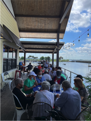 Seniors gather under the porch of Big Toho Marina for several rousing games of bingo. PHOTO/HAYES FINKLEA