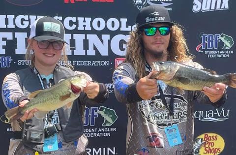 A couple members of the Osceola Anglers show off their catches at last month’s Student Angler Federation. PHOTO/OSCEOLA ANGLERS