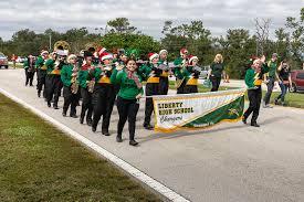 School bands, like the Liberty High marching band pictured in 2021, are part of the APV Holiday Celebration -- come see them Saturday. FILE PHOTO