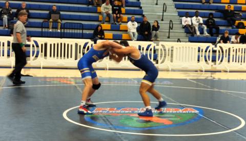 Anderson Heap (left) locks up with Darian Monserrate of George Steinbrenner High Thursday. Heap, a two-time state champion, won the match to help Osceola earn a spot in the FHSAA state duals tournament starting Friday. PHOTO/J. DANIEL PEARSON