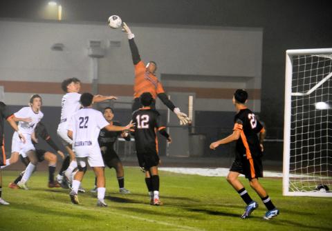 Tohopekaliga goalie Jason Barrientos turns away a shot early in Friday's Orange Belt Conference boys soccer championship game. PHOTO/KATIE WILLIAMS