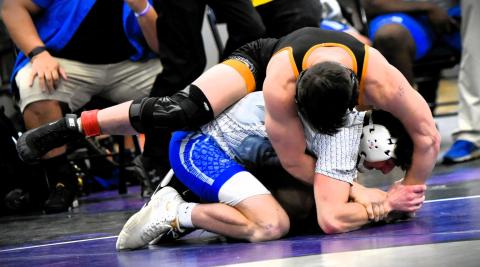 Harmony's Shawn McCallister (top) defeated Osceola's Anderson Heap in a battle of state-ranked wrestlers for the 157-pound title at Saturday's Orange Belt Conference championship. PHOTO/KATIE WILLIAMS