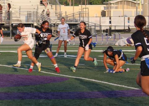 Harmony's Jada Bloodworth, who made two big plays on defense Thursday, tries to speed away from the Celebration defense on a rushing play in Thursday's 13-0 Class 2A win. PHOTO/KEN JACKSON