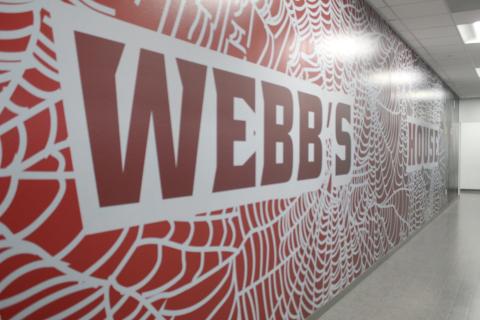 A mural outside Gateway High's new weight room honors an old coach, Dwayne Webb, who was instrumental in the Panther's strength training program — and athlete's overall lives. PHOTO/KEN JACKSON