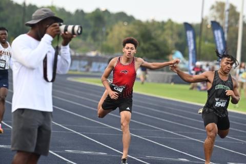 Gateway’s Jose Calderon stretches at the tape in the finals of Friday's 400 meter final at the Class 3A state championship meet in Jacksonville. PHOTO/JULIE ANDREW, GATEWAY H.S.
