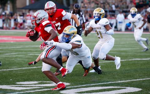 Osceola linebacker Elijah brings down Lake Mary running back Isaiah Thomas in Friday's 24-7 loss at Lake Mary. PHOTO/TAYLOR MCFEE