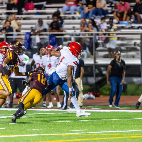 Poinciana quarterback fights for yardage in the Eagles 19-7 win Friday over St. Cloud. PHOTO/TAYLOR MCFEE