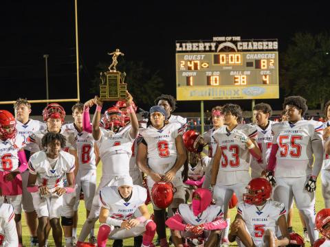 Poinciana celebrates its 47-9 win over Liberty Friday in the Battle of the Boulevard. PHOTO/MARIO CASAMALHUAPA