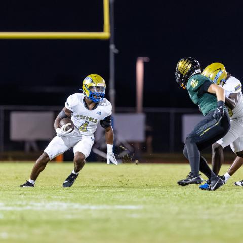 Osceola running back Taevion Swint rushed for four touchdowns in the Kowboys' 49-9 district-clinching victory Tuesday at Viera. PHOTO/TAYLOR MCFEE