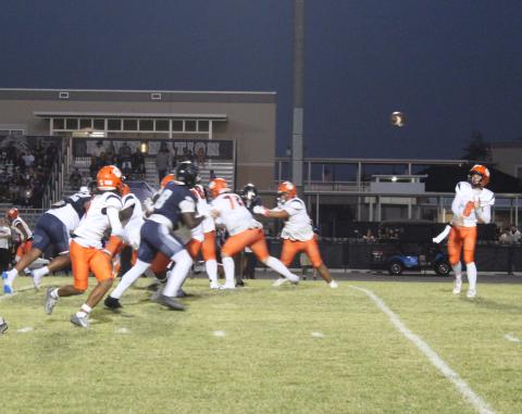 Tohopekaliga's Sabby Meassick passes to Tony Brown early in Friday's game against Lake Nona. PHOTO/KEN JACKSON