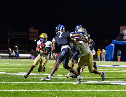 Osceola's Alijah Jenkins (3) throws a block for Taevion Swint, who gained 139 yards and scored the Kowboys' two touchdowns, in a hard-fought 17-7 win over Armwood in the Region 6A-2 championship Friday. OHS moves onto the state semifinals. PHOTO/TAYLOR MCFEE