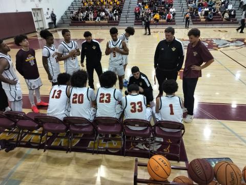 Coach Tommy Billiteri discussed 4th quarter strategy with his team; the Bulldogs came back for a 59-58 win over Lake Highland Prep Tuesday. PHOTO/J. DANIEL PEARSON