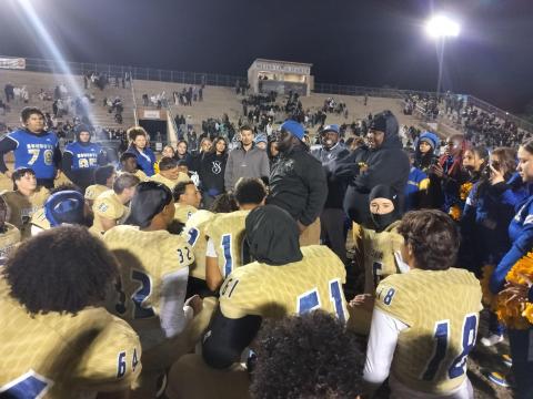 Osceola Coach Eric Pinellas and other coaches address the team after the Kowboys' 41-35 state semifinal win Friday over Buchholz High in Gainesville. PHOTO/J. DANIEL PEARSON