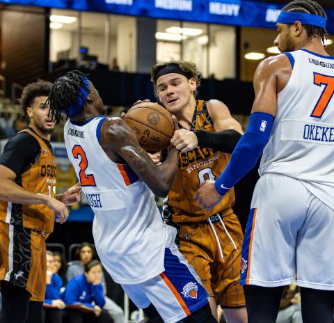 Osceola's Mac McClung fights for a loose ball with Westchester's Damion Baugh. PHOTO/TAYLOR MCFEE