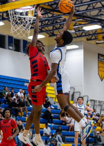 Poinciana (in red) and Osceola are two of the teams that have qualified for the FHSAA regional basketball playoffs. PHOTO/TAYLOR MCFEE