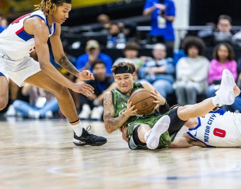 Osceola' Mac McClung, fighting for a loose ball, willed the Magic to victory with 26 points and five assists in Wednesday's 109-105 win over the Motor City Cruise at the Silver Spurs Arena. PHOTO/TAYLOR MCFEE
