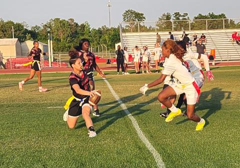 Gateway quarterback Patricia Rodriguez runs the ball against a closing Hillsborough defender in Wednesday's Class 3A flag football regional quarterfinal. (Photo/Ken Jackson)
