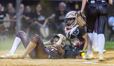  St. Cloud's Karly Kuchinskas slides into the tag of Harmony's catcher in Wednesday's district championship game. (Photo/Taylor McFee)