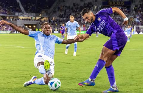 Orlando City's Martin Ojeda , shown here working against NYCFC defender Tayvon Gray Wednesday, provided the scoring punch in the Lions' 2-1 victory Saturday at the New England Revolution. (Photo/Taylor McFee)