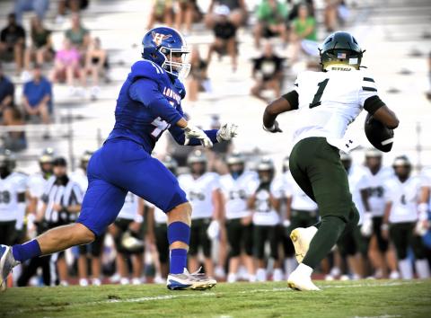 Harmony defensive end Brody Malukiewicz chases down a Villages ballcarrier in Friday's Kickoff Classic. (Photo/Katie Williams)