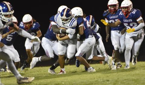 Nick Bertolani runs for a few of his 56 yards in Harmony's 55-20 win over Poinciana Friday. (Photo/Katie Williams)