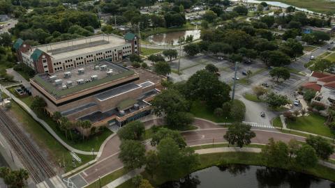 The city of Kissimmee now have final agreement with Azure Hotel International to build a 300-room hotel on the site of the current Civic Center, and a new convention center on the current parking lot.  The SunRail parking garage (at top) will remain. (Photo/City of Kissimmee)