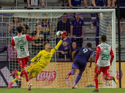 Luis Muriel scores on a beautiful header Wednesday. He had three goals in 14 minutes of Orlando City's 5-1 Leagues Cup win over Nexaca. (Photo/Mario Casamalhuapa)