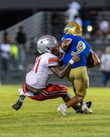 Jaxson Hardnett, shown in last week's game against Lake Mary, was part of Osceola'a scoring punch Friday, with touchdown runs of 23 and 4 yards. (Photo/Taylor McFee) 