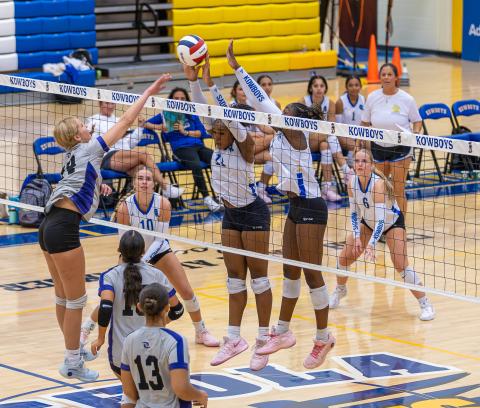 Sophie Spivey (10), Mikayla Matthews (11) and Brooklyn Sippio (3), shown here in the District 7A-7 tournament, were key to the Osceola Kowboys' three-set regional playoff semifinal win at OHS Saturday. (Photo/Taylor McFee)