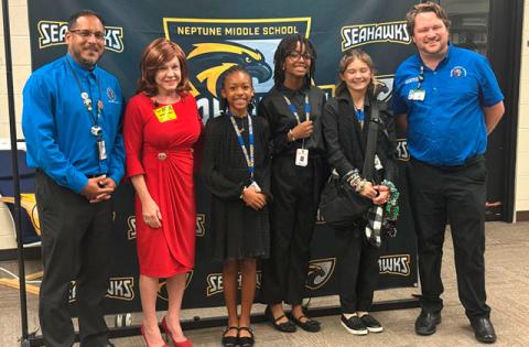 Osceola School District Director of Middle School Curriculum Henry Santiago, Rep. Paula Stark and Education Specialist for Social Studies Cory Puppa pose with the winning team of Carly Lech, Lucy Graham and Elysmar Francois at Friday’s “Build-A-Bill” competition. (Photo/David Chivers)