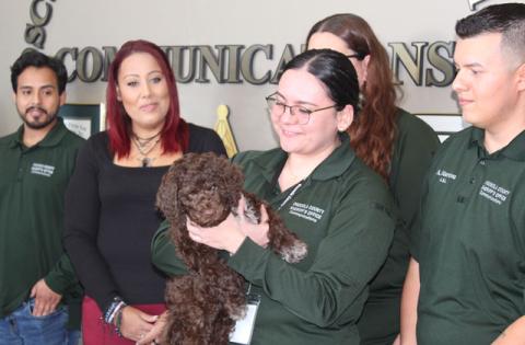 The Osceola County Sheriff’s communications team introduces its newest co-worker, therapy dog Echo. (Photo/Ken Jackson)