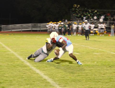Liberty linebacker Rashad Robinson brings down Poinciana quarterback Terrell Jones in Friday's Battle of the Boulevard, a 38-0 Poinciana win. (Photo/Ken Jackson)