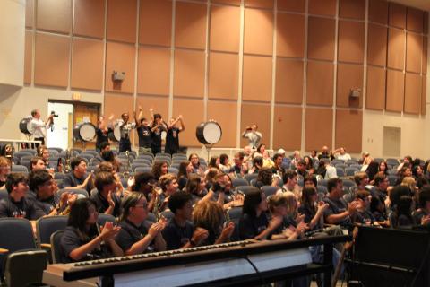 The members of the Harmony High School "Sound of the Stampede" marching band react Thursday to news they've been invited to participate in the London New Year's Day Parade on Jan. 1, 2027. (Photo/Ken Jackson)