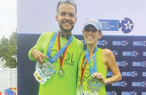 Celebration’s Conor Delaney, pictured with his wife Liz, is a veteran of the world’s biggest marathons. He’ll see a lot of the world running races later this month. (Submitted Photo)