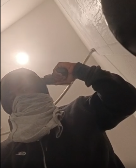 A suspect who barricaded himself in a Kissimmee apartment broadcast himself holding a gun to his head in a bathroom on Facebook Live most of the day Friday. (Facebook)