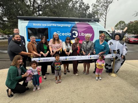 County and library officials cut the ribbon Tuesday on OLLie – the new Osceola Library Link van, fully equipped to serve as a Library on the Move to places not near existing libraries. (Photo/David Chivers)