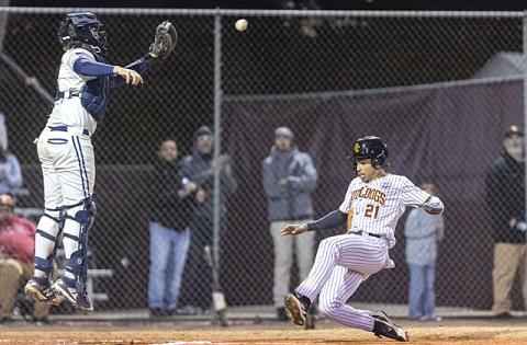 St. Cloud’s Adrian Carradero slides into home under a Harmony throw at last week’s Mike Fields Preseason Classic. (Photo/Taylor McFee)