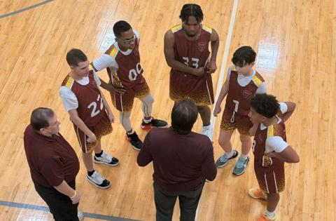 St. Cloud Unified basketball coaches John Stump and Braxton Ansbaugh talk with players during a recent game. (Submitted Photo)