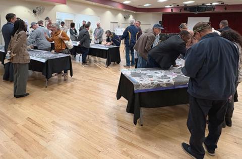 Residents view aerial displays of the proposed Sunbridge Parkway Extension Project. (Photo/Terry Lloyd)