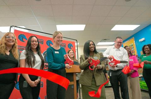 Chestnut Elementary School in Poinciana cut the ribbon on its new school food pantry made possible by an investment the Poinsette Foundation made in four county schools. (Photo/Second Harvest Food Bank)