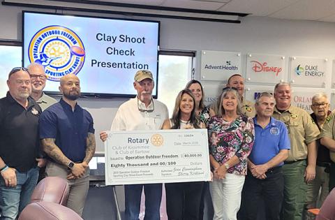 David Hunt, Dept of Forestry Operation Outdoor Freedom and Kissimmee Rotarian event chair Amber Adams. (Photo/Camille Levee)