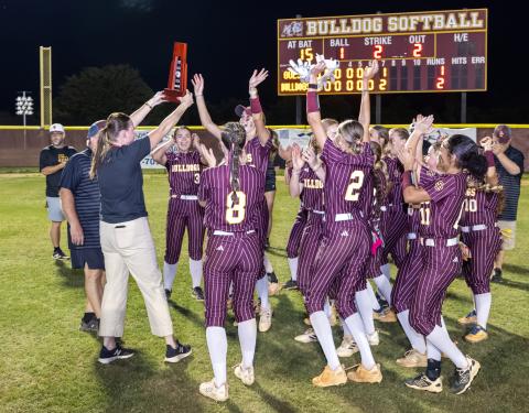 It all tells the story — scoreboard, and the St. Cloud celebration, as the Bulldogs rallied in the bottom of the seventh inning to beat Harmony, 2-1, in the District 7A-6 championship game. (Photo/Taylor McFee)