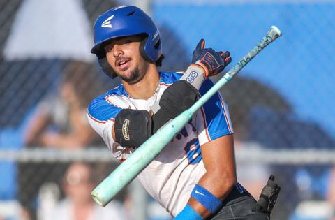 A two-run triple by Harmony's Angel Medina, shown here in the District 7A-9 championship game, was the big blow in third inning of a 6-5 regional playoff victory Friday over St. Cloud. (Photo/Taylor McFee)