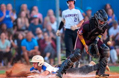 After delivering a two-run double in the fourth, Harmony's Ashton Fayne tacks on another Longhorn run beating a throw to the plate in the home team's 8-2 District 7A-9 win Friday. (Photo/Taylor McFee)